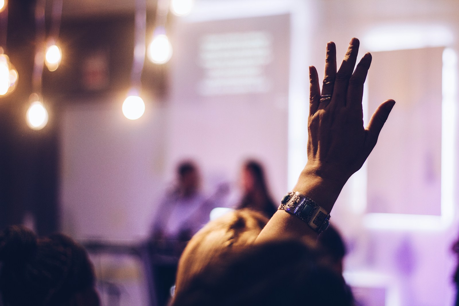 Photo by Marcos Luiz Photograph person raising hand